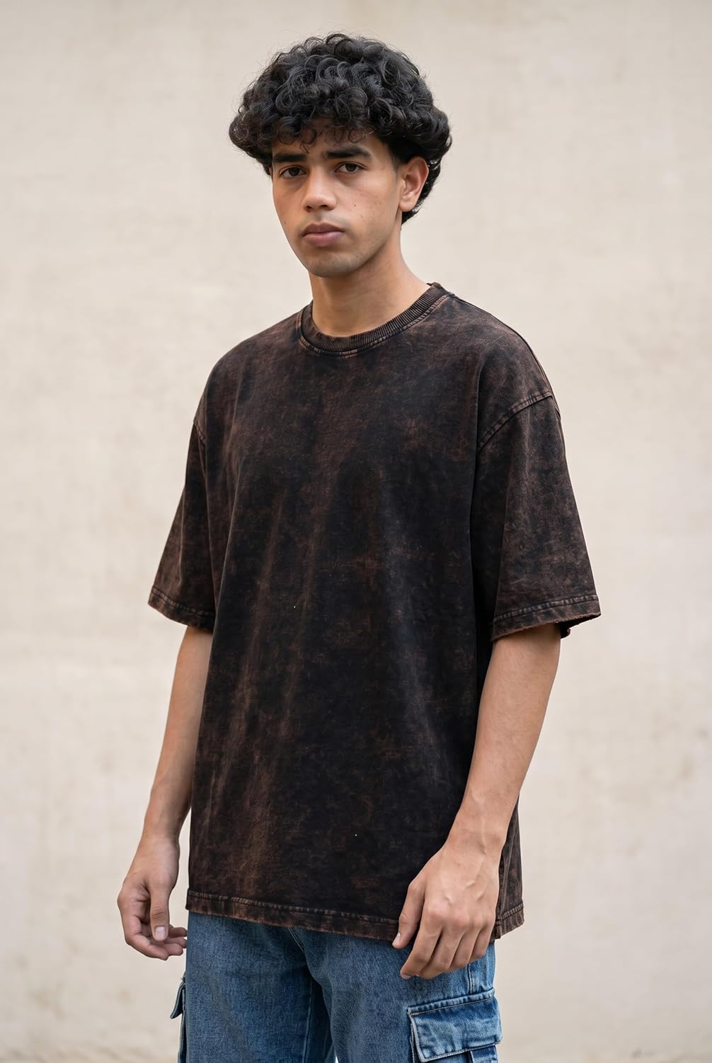 Black oversized unisex cotton T-shirt by SnatchStyle with drop shoulder design and dye-washed street look.